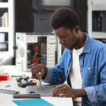 close-up-man-working-computer-chips (1) close-up-man-working-computer-chips (1)